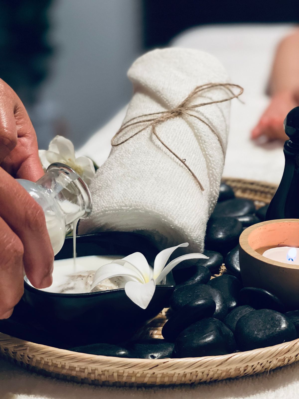 Towels, candles and diffuser in a calm treatment room